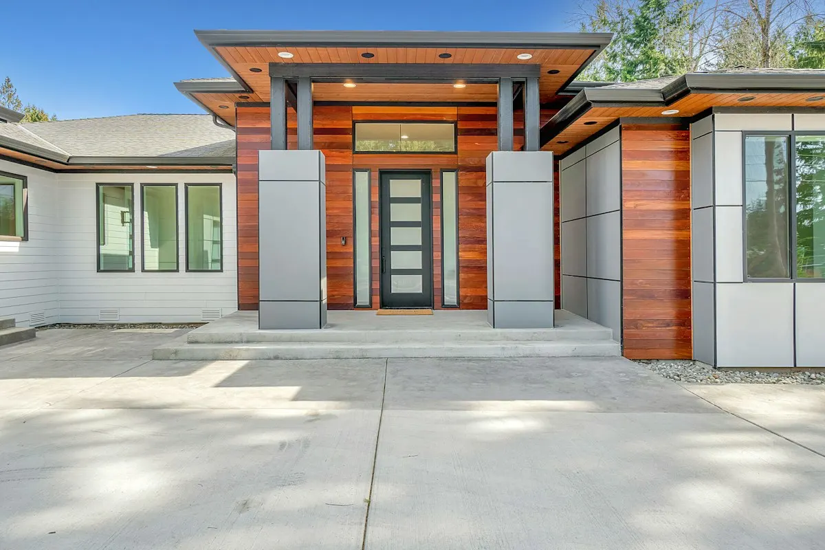 House entrance beneath a timber-framed canopy