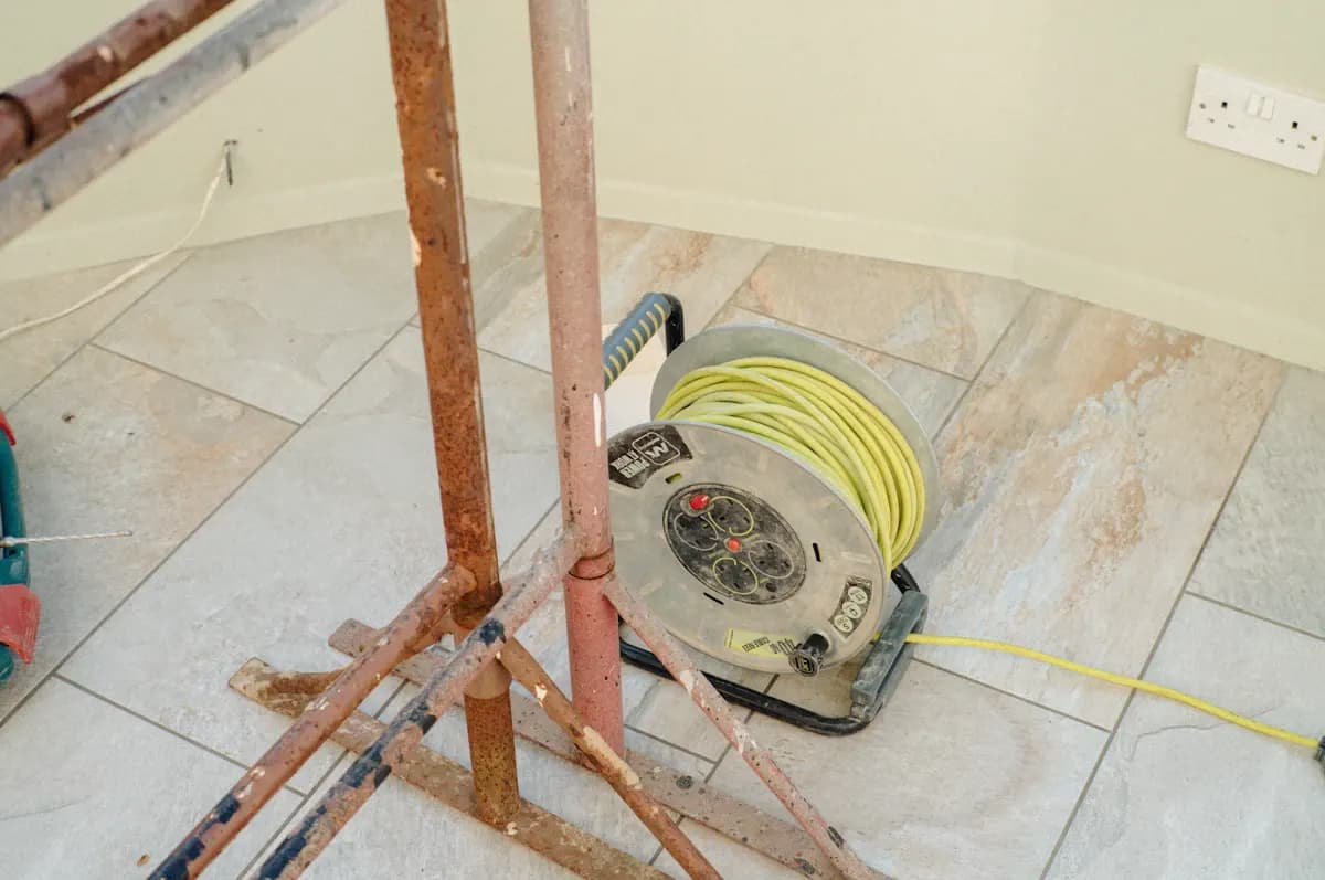 Electrical cable reel beside timber framing during a renovation