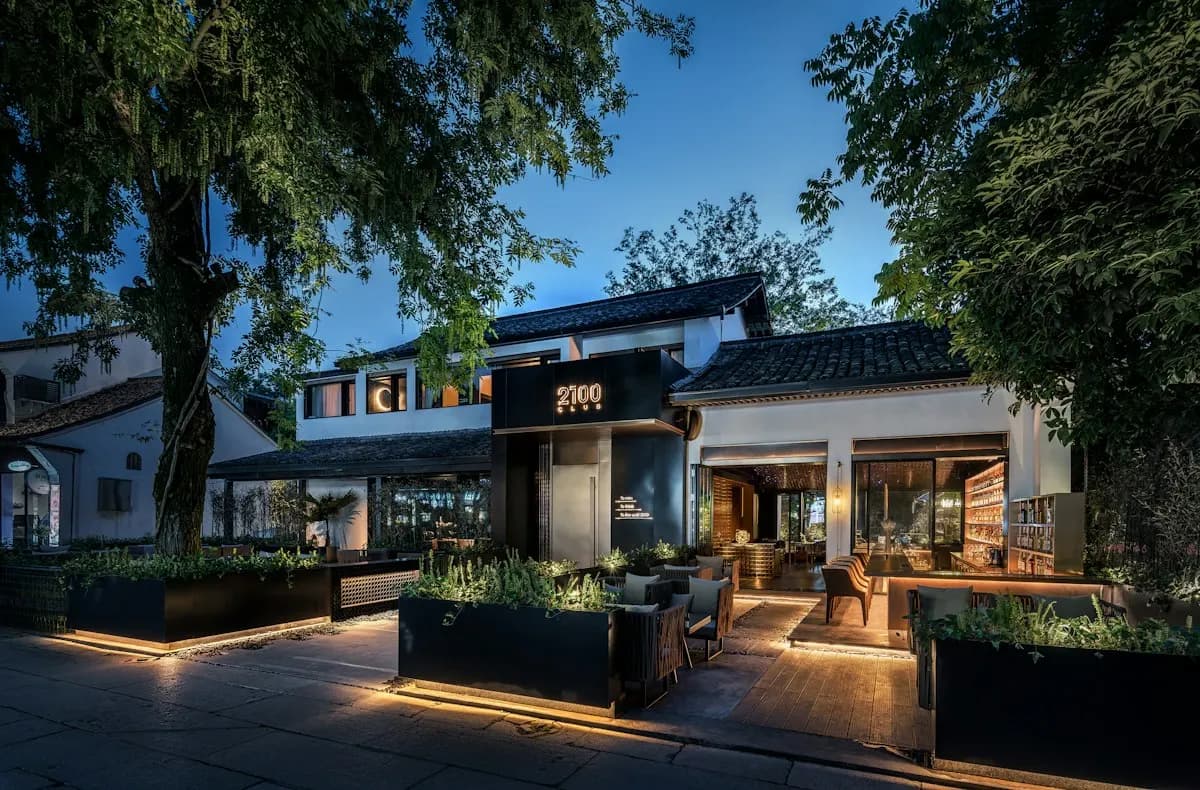 Low house exterior with a landscaped entrance