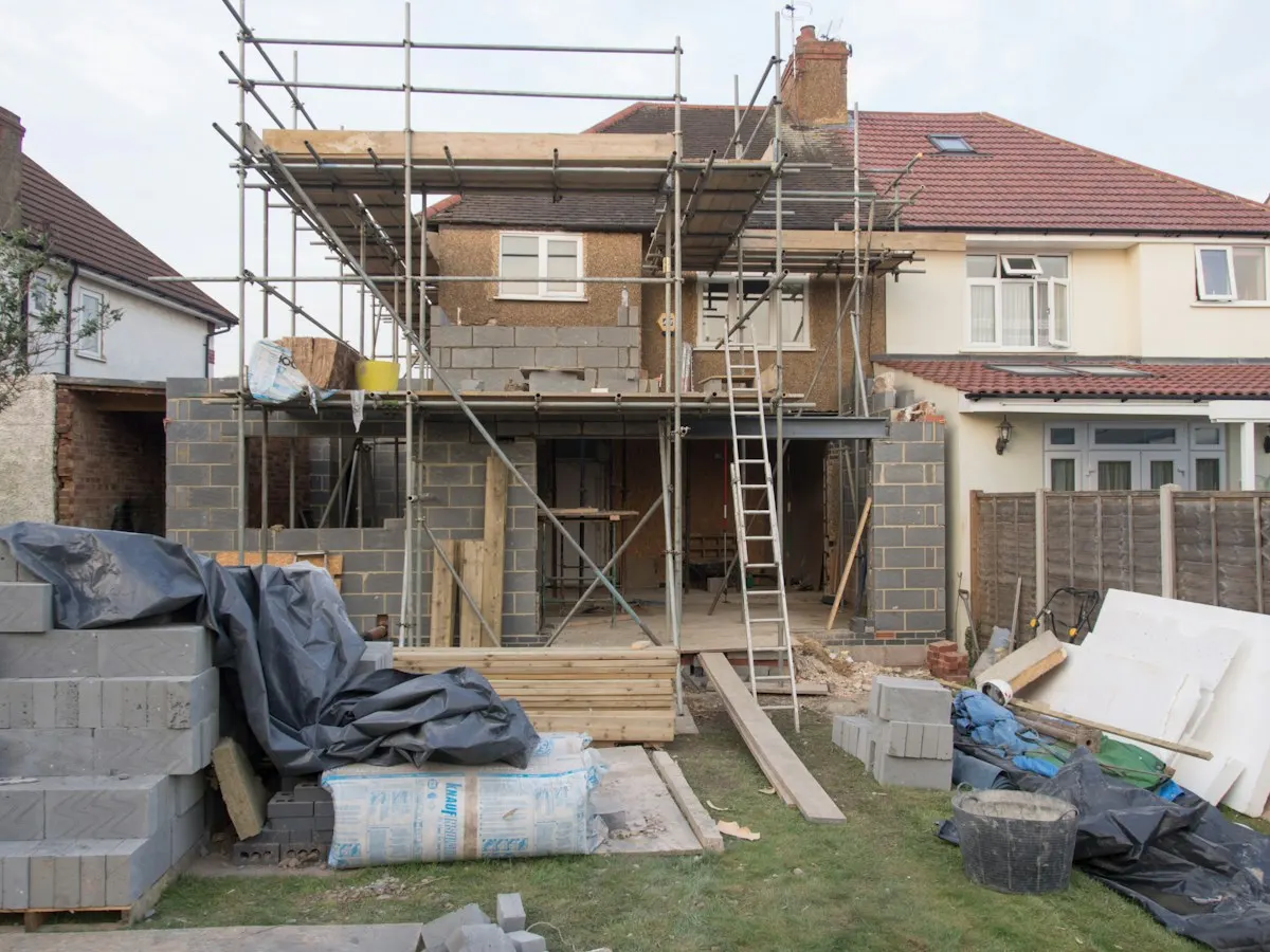 Rear extension construction beside stored building materials