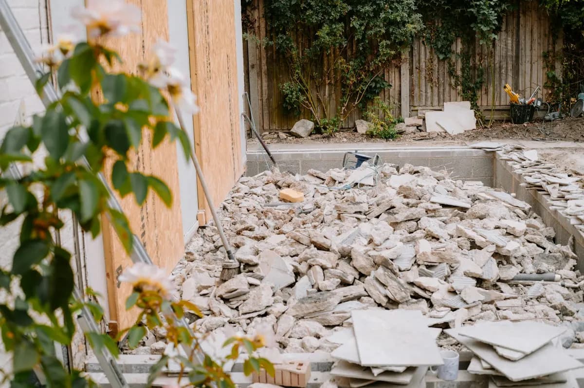 Demolition rubble beside the outer wall of a renovation