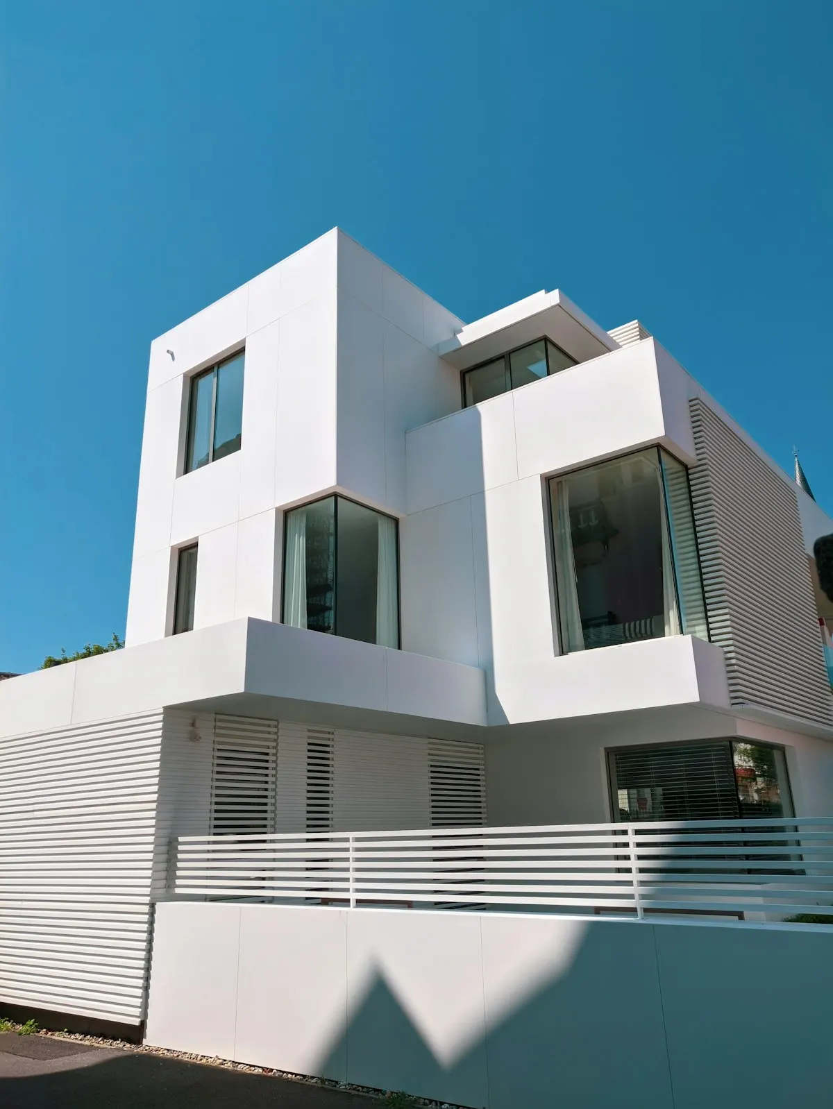 Contemporary house with tall windows and a flat roof