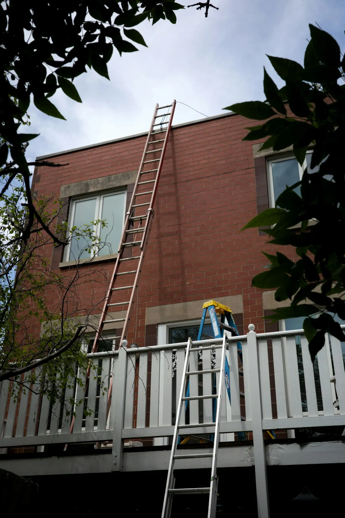 Exterior of a house addition with a timber balcony