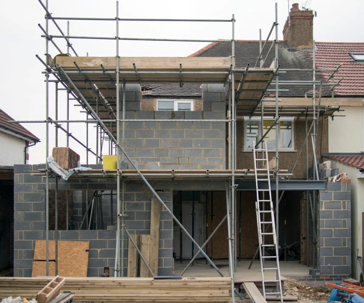 Scaffolding around a new two-storey house extension