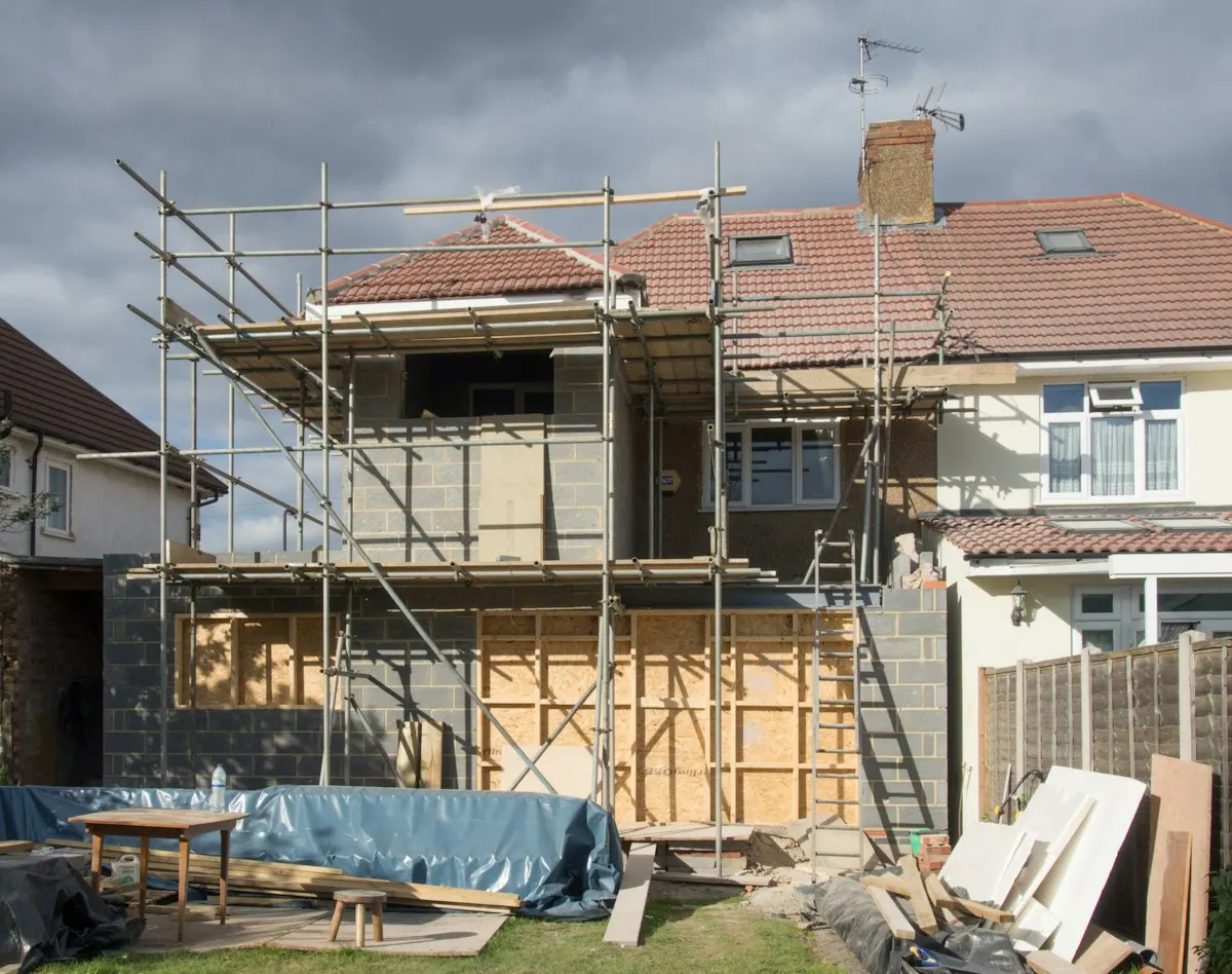 Rear house extension with roof framing and masonry walls